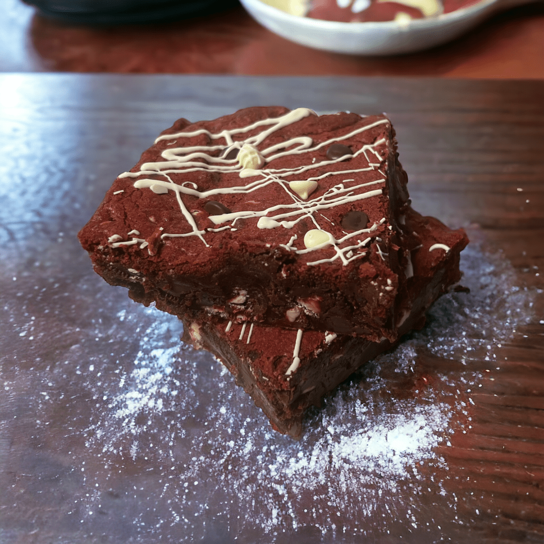 A brownie sitting on top of a wooden table.