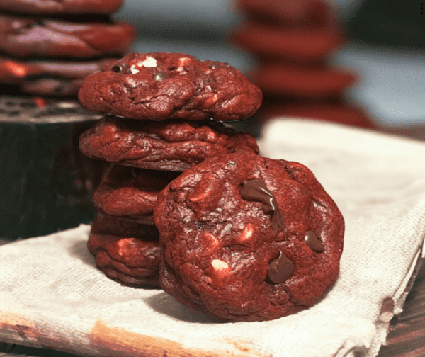 A stack of chocolate cookies on top of a table.