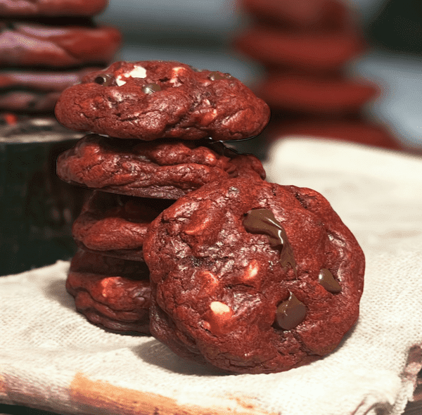 A stack of chocolate cookies on top of a table.