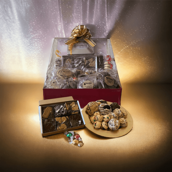 A box of cookies and chocolates on top of a table.