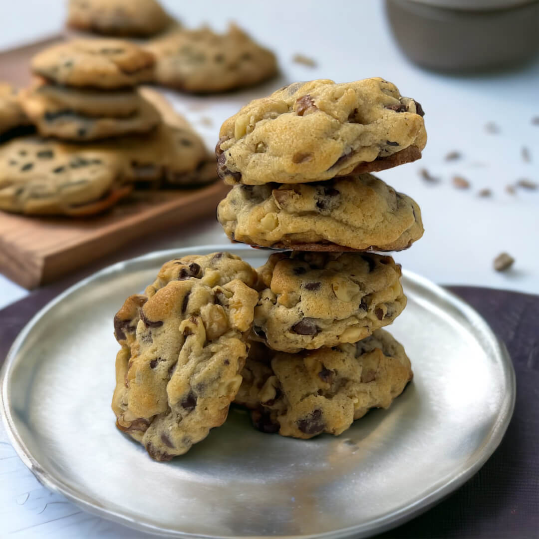 A plate of cookies stacked on top of each other.