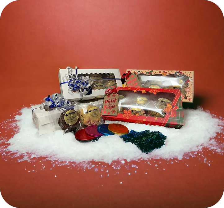 A pile of snow with some gift boxes on top