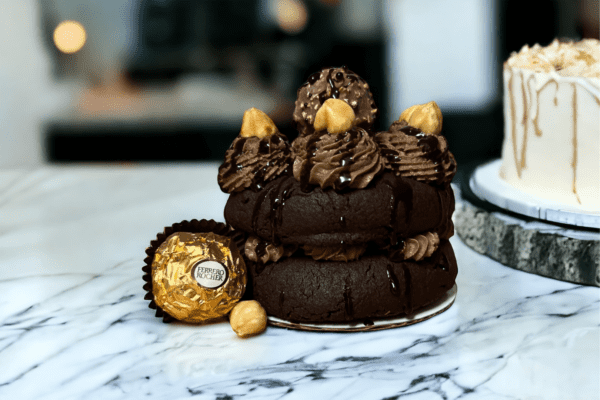 A chocolate cake with peanut butter on top.