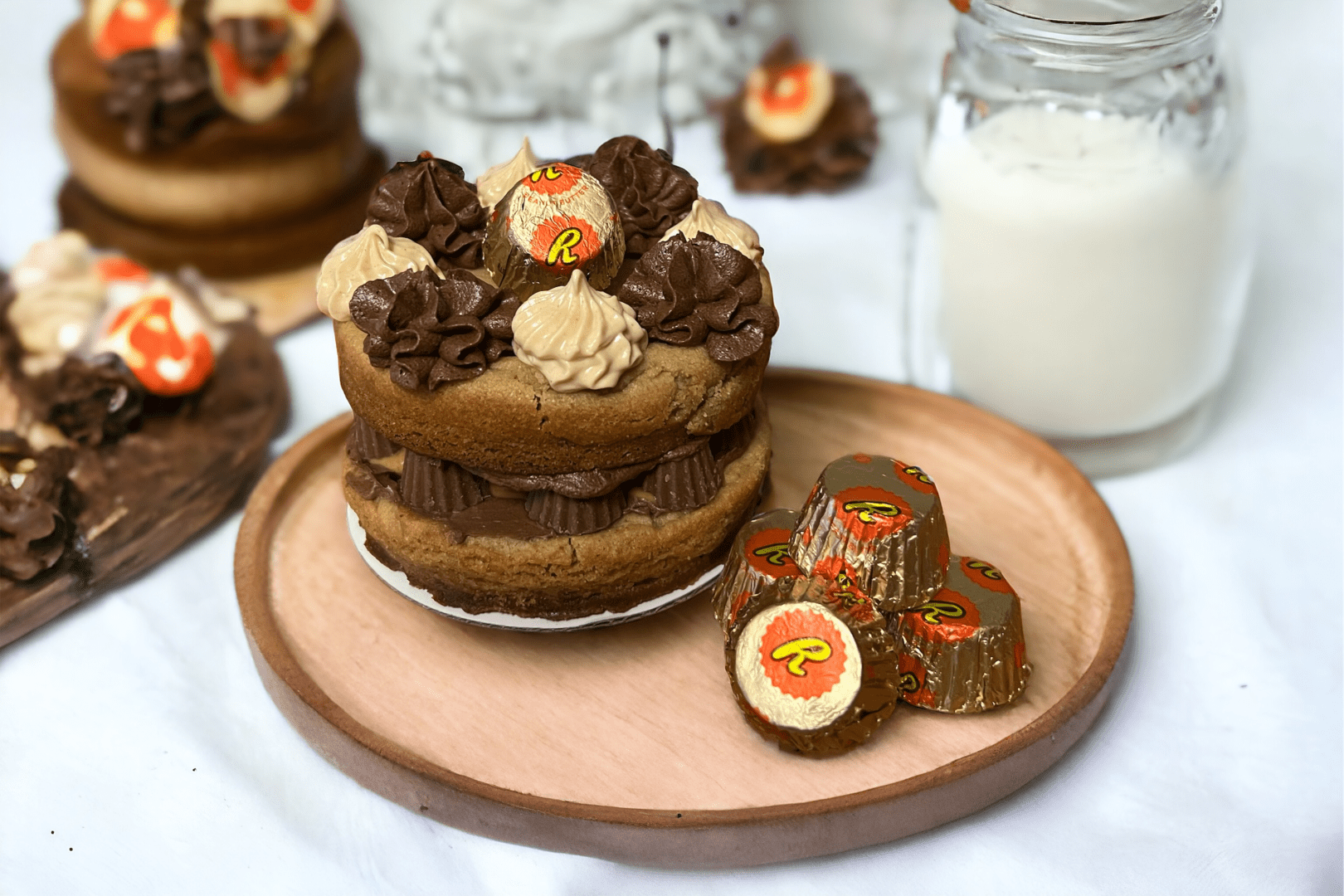 A plate of cookies and chocolates on top of the table.