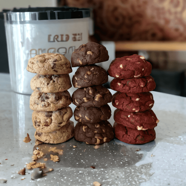 A table with three stacks of cookies on it