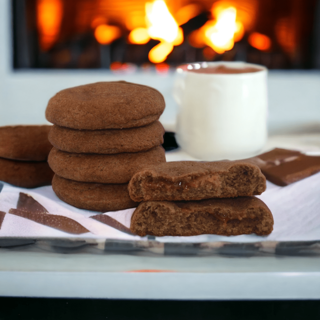 A table with some cookies and a cup of coffee